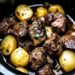 crockpot garlic butter beef bites with potatoes